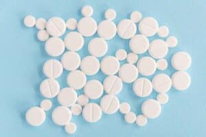 Top view of white medical tablets for clinical trials services by euromed pharma